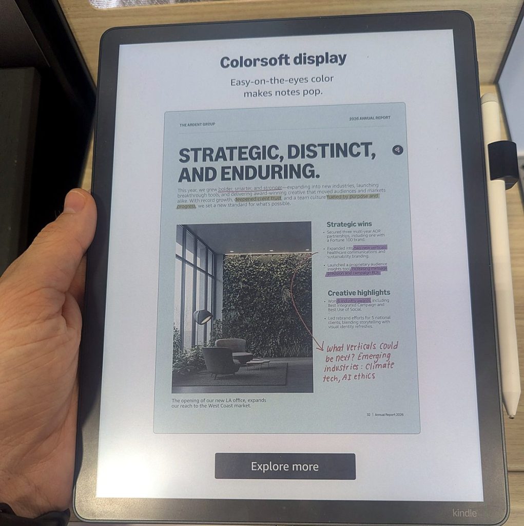 Holding the Kindle Scribe Colorsoft color e-ink tablet to show its size